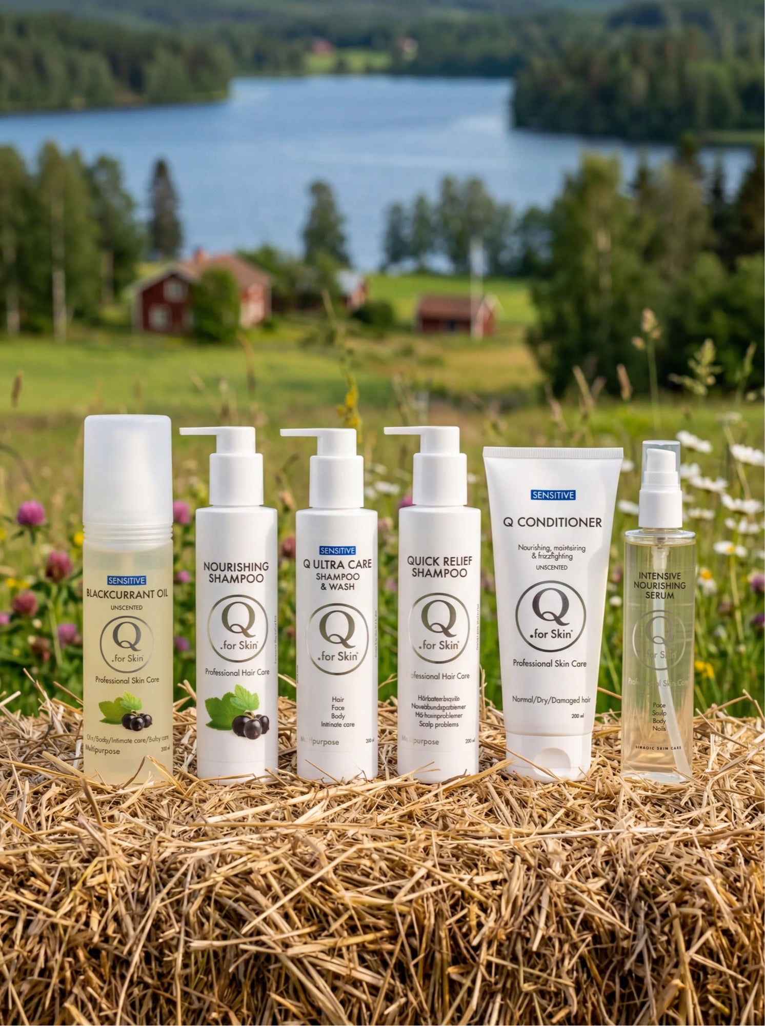 Q for Skin hela hårvårdsserien på en höbal vid en svensk sjö